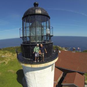 Mary Hillary and her husband Greg Guckenburg atop Seguin Lighthouse. Courtesy of Appalachian Mountain Club