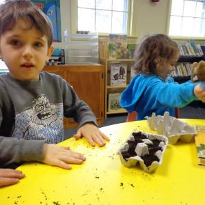Dean and Fiona don’t mind getting their hands dirty to get some seedlings started. Courtesy of Natalie Castonia