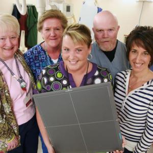 Pictured are LincolnHealth Diagnostic Imaging staff members, from left: Lana Brandt, Mary Johnston, Jill Reynolds, Shane Creamer and Pam Hepburn. Jill Reynolds is holding a new wireless digital radiological sensor that makes getting an X-ray at the Miles Campus of LincolnHealth quicker, more convenient and safer. The new sensor also provides images that are as good as any in the state, even at much larger hospitals. Courtesy of LincolnHealth