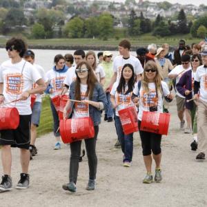 Maine Music Outreach students walk around Back Cove in Portland, drumming out Haitian rhythms on buckets donated by Hammond Lumber, during the May 31 event. Courtesy of Dean Curran