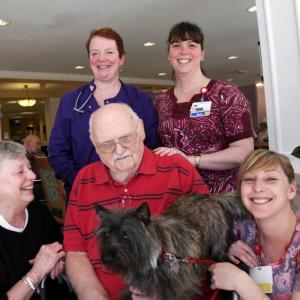 Veteran Harold “Hutch” Hutchinson and Irene Hutchinson (on left) with Gregory Wing staff, Suzanne Cavalieri, RN, (standing, on left), Elizabeth Barter, RN, (standing, on right) and Kaitlyn DeRepentigny, CNA. Courtesy of LincolnHealth