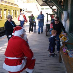 Santa is making plans for his summer vacation in the Boothbay region to support the second annual Toys for Tots toy drive at the Boothbay Railway Village on Friday, July 25. Each adult or child who brings a new, unwrapped toy to donate will be treated to free admission to the museum and, of course, a steam train ride. Courtesy of Margaret Hoffman