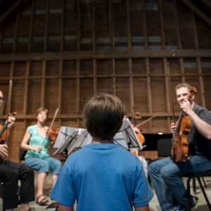 Damariscotta River Association Music and Nature students work directly with Salt Bay ChamberFest musicians before the final performance on August 16 at the Lincoln Theater at 10:30 a.m.