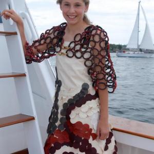 Fishin' For Fashion model, Olivia Paolillo is wearing a custom fishing design made with vintage sailcloth, sail stabilizers, signal flag and grommets. Jacket is made with fuel hose and hog rings. Courtesy of Robert Mitchell and Lori Pecor