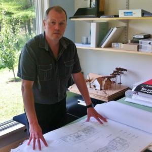 Tor Glendinning stands with the plans for Lincoln Academy's new buildings. The local architect also worked on the Boothbay Harbor Memorial Library this year. WILL McCARTHY/Wiscasset Newspaper