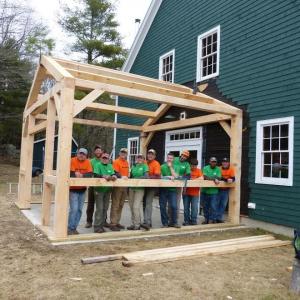 Students pose at the end of the April 2014 class under the finished frame of new welding shop that was installed at a nearby farm. Courtesy of HVNC