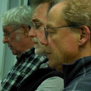 Three Tapestry tenors focus on their part in a recent rehearsal. Courtesy of Rosie Bensen