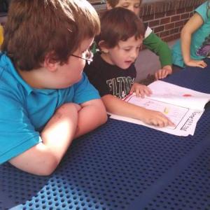 Mrs. Hallowell's kindergarten and Miss Brown's second grade classes came together as authors in a lovely outdoor classroom last week at Wiscasset Primary School. Miss Brown's class shared its story, entitled "The Acorn's Battle." Then the kindergarten students partnered up with second grade students to read their very first published stories. Everyone is looking forward to sharing more stories as our writing grows. Courtesy of Becky Hallowell/Wiscasset Primary School