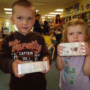 Henry and Mollie Uleau show their finished boxes. Courtesy of Wiscasset Public Library