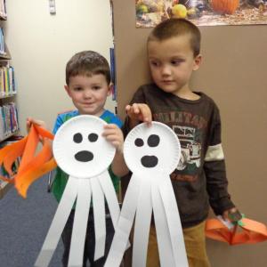 Ethan Clark and Henry Uleau compare Halloween ghost decorations. Courtesy of Natalie Castonia