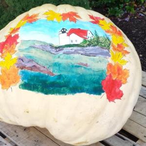 THIS PUMPKIN will remain outside the Boothbay Harbor Region Chamber of Commerce for the Damariscotta Pumpkinfest and Regatta and Boothbay Fall Foliage Festival this weekend. Other pumpkins won’t be so lucky: They will meet a gruesome and glorious end, whether by trebuchet, motor boat, gravity or pie. BEN BULKELEY/Boothbay Register