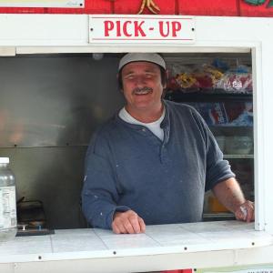 GARY STARANKEWICZ in his doghouse. SUZI THAYER/Boothbay Register