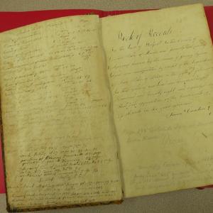 Westport Island's original record book, 1828. The notation inside reads: "Book of Records. For the town of Westport in the County of Lincoln State of Maine and formerly that part of Edgecomb known by the name of Jeremy Squam Island and incorporated by an act of the Legislature of said State of Maine on the fifth day of February in the year of our Lord one thousand eight hundred and twenty eight and organized and went into operation on the seventeenth day of March in the year aforesaid." Simon Dunton, Town Clerk. Courtesy of Gaye Wagner/Westport Island