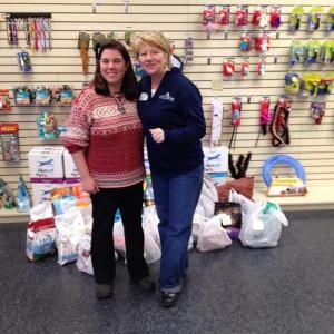 12 Woofs of Christmas — The Animal House co-owner Aubrey Martin, left, is pictured with ARLGP Executive Director Patsy Murphy. Courtesy of Aubrey Martin