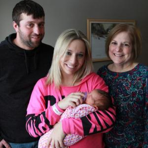Dad Jeremy Yeaton and mom Jasmine Doughty (center) with their daughter Harper, the first baby of the new year born on the Miles Campus of LincolnHealth. Harper arrived on January 4 at 2:55 p.m. with Lincoln Medical Partners Nurse Midwife Cindy Dublin-Morin in attendance. Courtesy of LincolnHealth
