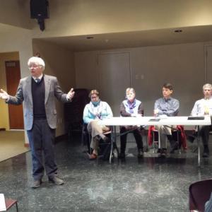 Representative Mick Devin, left, talks to the crowd Friday, Jan. 23 at Skidompha Library in Damariscotta. The topic of the meeting? A proposed property tax on nonprofits that would be used in lieu of revenue sharing. BEN BULKELEY/Wiscasset Newspaper