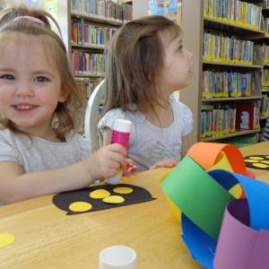 Sisters Sadielynn and Addison West work on creating a rainbow paper chain. Courtesy of Natalie Castonia