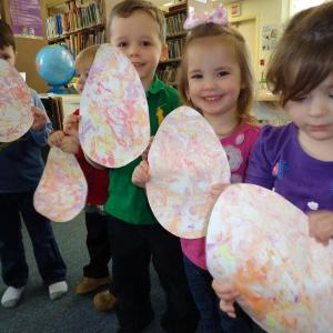 The children at story hour display their Easter eggs made with shaving cream. Courtesy of Natalie Castonia