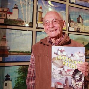 Former lighthouse keeper Ernest DeRaps wrote a book on lighthouse keeping with his wife Pauline. His section of the book is entitled “Lighthouse Keeping,” hers is entitled “Light Housekeeping.” Since he retired at the age of 80, from his third career building houses, he has painted each of Maine’s 65 lighthouses. Courtesy of Alan Crowell/LincolnHealth