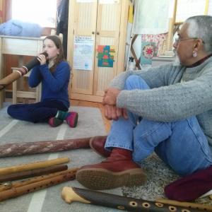 Hawk Henries listens as Sierra Morgan plays one of his instruments. At left is Zoe Brush. Courtesy of Jane Frost