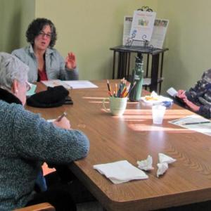 Carrie Levine, CNM (far end of the table) leading a women's health workshop at Spectrum Generations Coastal Community Center in Damariscotta. Courtesy of Marianne Pinkham