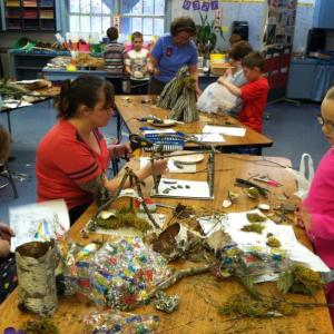Students and volunteers build their fairy houses. Courtesy of Donna Barnes