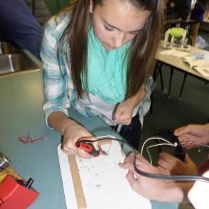 Maggie Larson, an eighth grade student at the Center for Teaching and Learning in Edgecomb, builds a remote-controlled submersible. Courtesy of Kamala Grohman