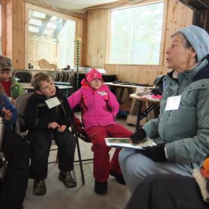 Biologist and coyote expert Geri Vinstein, right, talks to Juniper Hill students, from left, William Averill, Ben Arnold and Freya Drum, at Hidden Valley Nature Center. Courtesy of Jane Frost