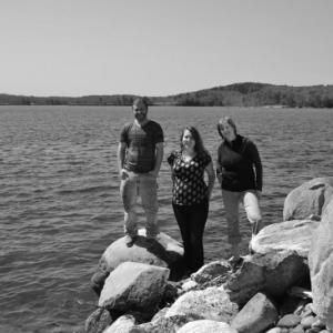 Graduate students, from left, Noah Oppenheim, Jesica Waller and Skylar Bayer on the shores of the Damariscotta River Estuary. All three have received awards for their research on lobsters and scallops. Courtesy of Linda Healy