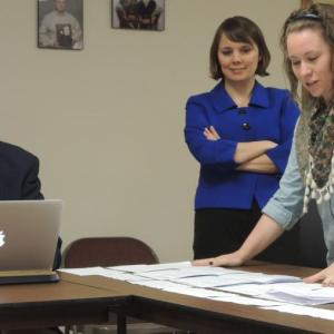Shenna Bellows watches as Kyle Bailey of the Committee for Ranked Choice Voting and Grace Ramsey of FairVote process the Lincoln County Democrats straw vote ballots. Courtesy of Dean Curran