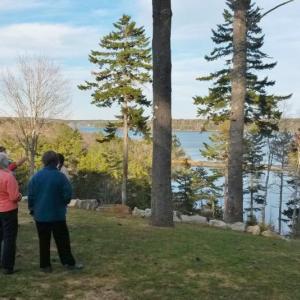 Sheepscot Valley Conservation Association committee members check out the site of SVCA’s fundraiser event “Champagne on the Sheepscot.” Courtesy of Kristin Pennock