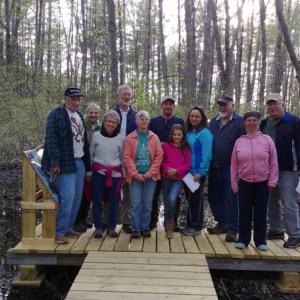 Westport Island’s selectmen join conservation commission members and guests on the new deck built to provide access to the Clough Point Preserve’s vernal pool. JANE CARPENTER/Wiscasset Newspaper
