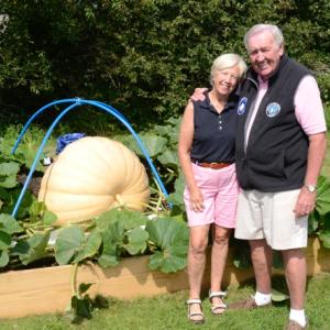 Boothbay Harbor residents Don and Debbie Snyder with their pumpkin "Beatrice" last August. Courtesy of Robin Mayer
