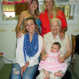 Five generations and counting! Martha Langer Sutter Hyler holds her great-great-granddaughter Jenyvieve Wyman on her lap Saturday afternoon. Also pictured are: rear left to right: Stacey Doray and Sally Doray-Wentworth. In the front is Jyllian York. Relatives and friends gathered at the Huntoon Hill Grange in Wiscasset to celebrate Martha’s 90th birthday. PHIL DI VECE/Wiscasset Newspaper