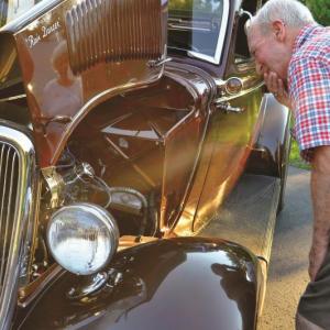 Lincoln Home resident Bob Albright checks out this beautiful car owned by the McKinnon family. Courtesy photo