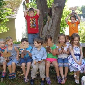 Story Hour attendees proudly display their paper moose heads outside. Courtesy of Wiscasset Public Library