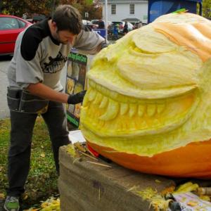 Carving time! Charlie Birchmeier at work during the Damariscotta Pumpkinfest and Regatta. One of the many pumpkins on display on Main Street. PHIL DI VECE/Wiscasset Newspaper
