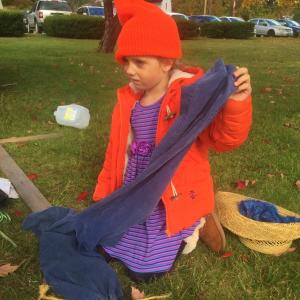 Audra Pekich, 5, of Wiscasset looks to grandmother Bonnie Pekich of Wiscasset for guidance while working on a scarecrow Saturday. SUSAN JOHNS/Wiscasset Newspaper Audra Pekich, scarecrow