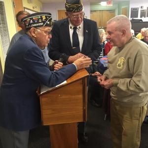 American Legion Area 3 (Lincoln, Sagadahoc and Knox counties) Commander Steve Jarrett, left, and American Legion Post 54 of Wiscasset Commander William Cossette Jr. meet with World War II veteran Wallace Roby of Wiscasset Nov. 11 at the Wiscasset Senior Center. SUSAN JOHNS/Wiscasset Newspaper