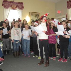 Edgecomb Eddy School students visit Edgecomb Green residents to sing carols and share the spirit of the season. Courtesy of Andrea Handel