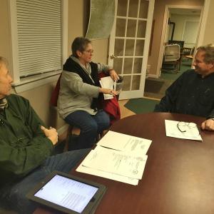 Wiscasset Airport Advisory Committee member Steve Williams, left, and Chairman Ken Boudin, right, listen to Selectmen’s Vice Chairman Judy Flanagan Feb. 17.