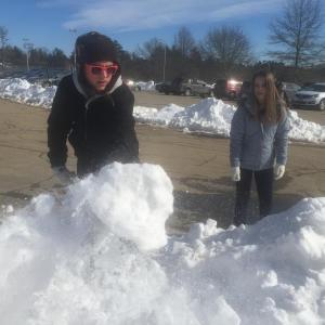 Wiscasset Middle High School sophomores Trinin Jeffrey, left, and Seven Claypool prepare to sculpt a crown of snow at the school’s winter carnival Feb. 12. SUSAN JOHNS/Wiscasset Newspaper
