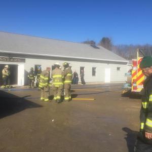 Firefighters work at the scene of a one-room fire at Robert L. Foster Antiques on Route One Feb. 22. SUSAN JOHNS/Wiscasset Newspaper