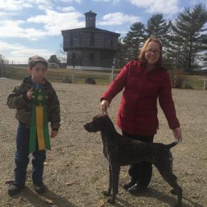 Zachary Poland, 11, of Edgecomb and his mother Lenore Parsons pose at Fort Edgecomb Feb. 18 with their German shorthaired pointer Gemma and the merit award the dog just earned at Westminster. SUSAN JOHNS/Wiscasset Newspaper