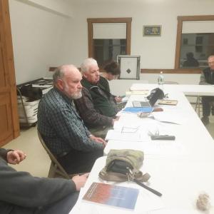 From left, Alna Second Selectman Melissa Spinney, First Selectman David Abbott and Third Selectman Doug Baston, along with resident Jon Luoma, listen to a comment March 9 at the fire station. SUSAN JOHNS/Wiscasset Newspaper