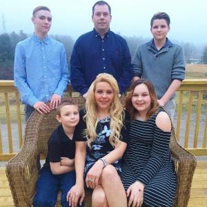 On their back deck near dusk March 17, front row, from left, Braden Peaslee, Heather Demeny and Olivia Peaslee; back row, from left, Tyler Peaslee, Ryan Demeny and Noah Peaslee. SUSAN JOHNS/Wiscasset Newspaper
