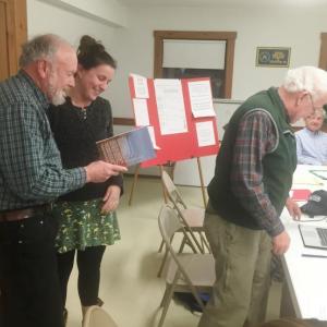 Alna Town Clerk Amy Warner, with First Selectman David Abbott on March 9, is honored at her final board meeting as clerk. Third Selectman Doug Baston returns to his seat. SUSAN JOHNS/Wiscasset Newspaper