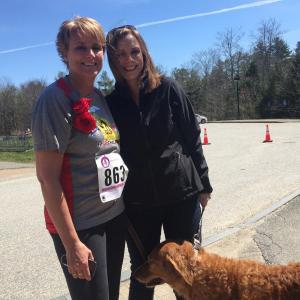 Tracy Verney of Newcastle, left, awaits the start of Saturday’s FitClass Challenge Four-Miler road race and walk with sister Kelsey Leeman of Bath and Leeman’s golden retriever rescue Cullen. SUSAN JOHNS/Wiscasset Newspaper