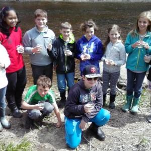 These Edgecomb Eddy School sixth graders releases Atlantic salmon eggs into the Sheepscot River on May 17 as part of a unit learning about the species’ life cycle. Pictured, from left, back row: Catherine Clifford, Angelica Rodriguez, Wesley Edgecomb, Ryan Clark, Lydia Currier, Elisabeth Wallace, Arden Carleton, Sage Kosky; front row: Ashton Cunningham and Henry Boudin.Courtesy photo