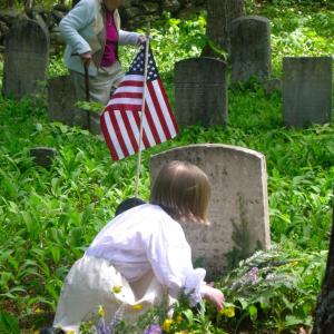 Eleanor Everson helps a new generation mark veterans’ graves at Pownalborough Court House Cemetery. Courtesy of Christine Hopf-Lovette